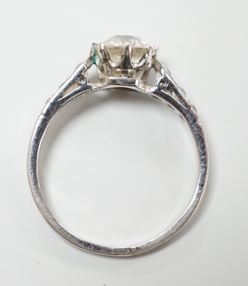 A mid 20th century white metal (stamped Plat) and single stone diamond ring, with diamond set shoulders, size J, gross 2.6 grams